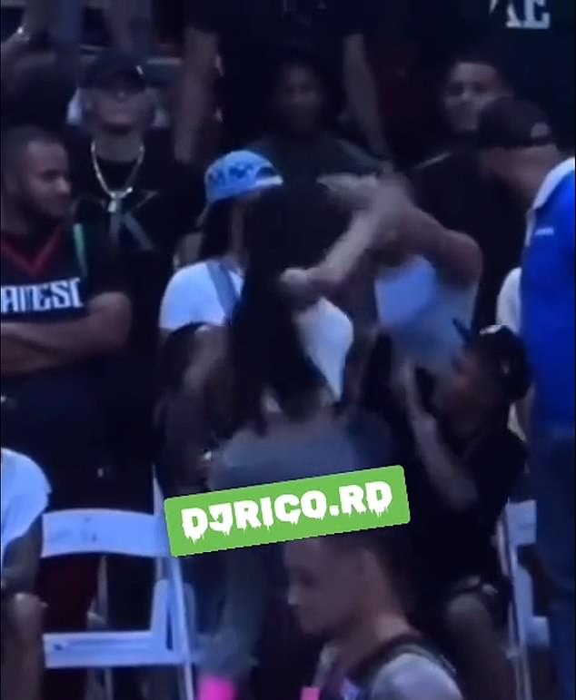 A Dominican rapper appeared to start a fight during a basketball game she attended with her one-year-old daughter