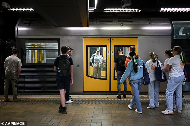 A three-day closure of Sydney's train network is expected to cause 'significant disruption' to millions of Aussies this weekend (pictured, commuters at Martin Place)