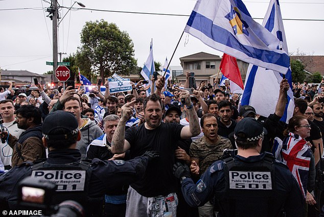 Pro-Israel activists gathered outside the Caulfield Hebrew Congregation on Monday evening following reports of a pro-Palestinian protest, which was called off at 11 p.m.