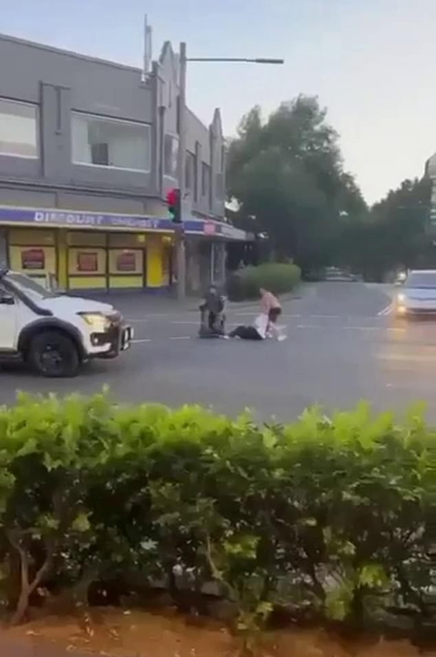 Footage filmed by a passerby showed Acherkouk stumbling into the center road outside a pharmacy warehouse as a man repeatedly shouted: 