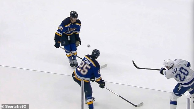 Dylan Holloway takes the puck in his neck during the first period of the NHL game on Tuesday