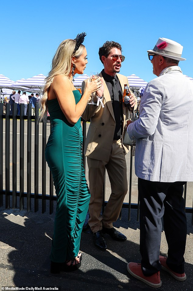 The Block's Kylie and Brad Baker were spotted befriending Channel Nine producer Julian Cress (right) at the Melbourne Cup, despite their alleged fallout