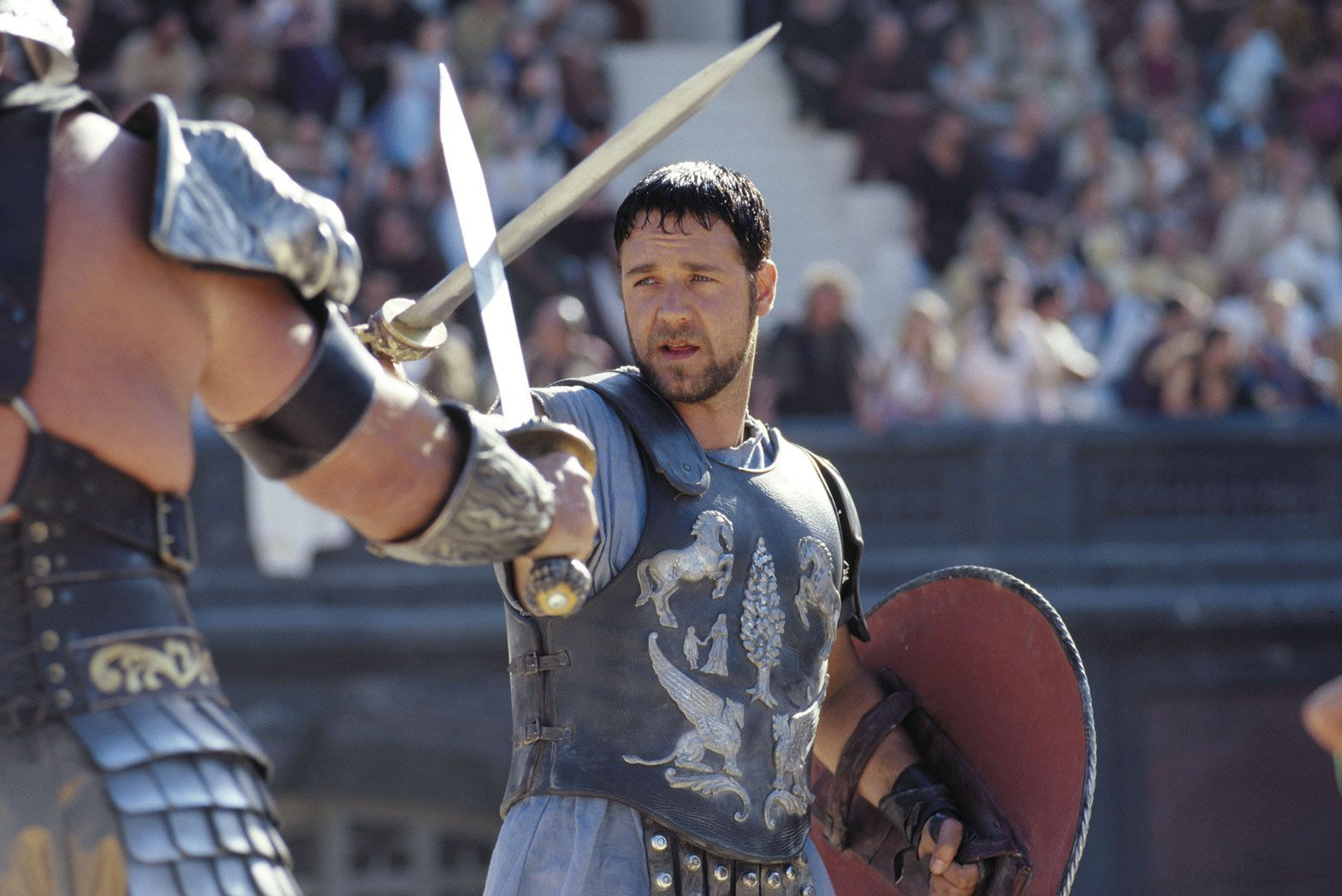 Russell Crowe crosses swords with another gladiator in Gladiator.