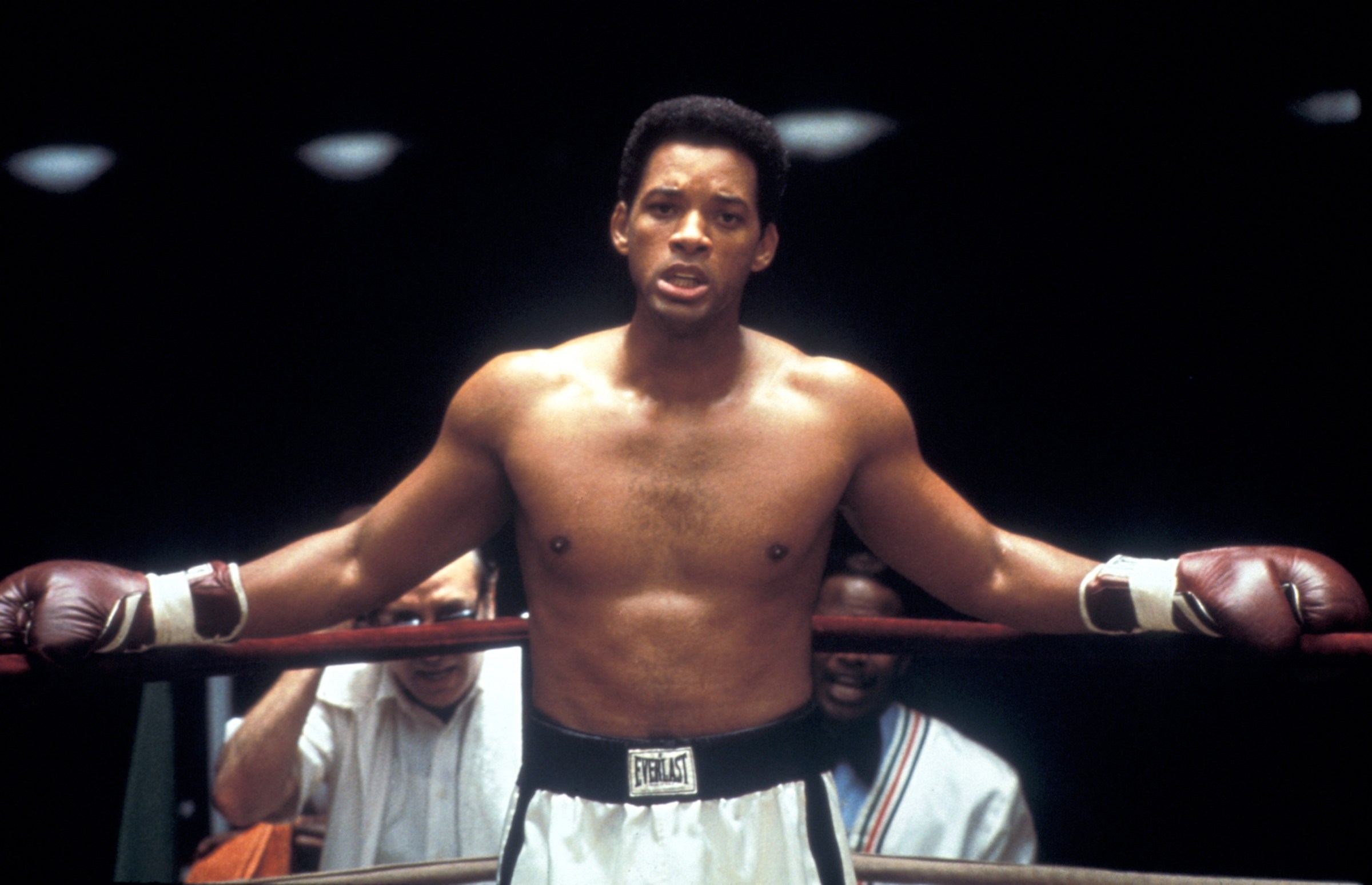 Will Smith in a boxing ring wearing gloves during a fight as Muhammad Ali in Ali 