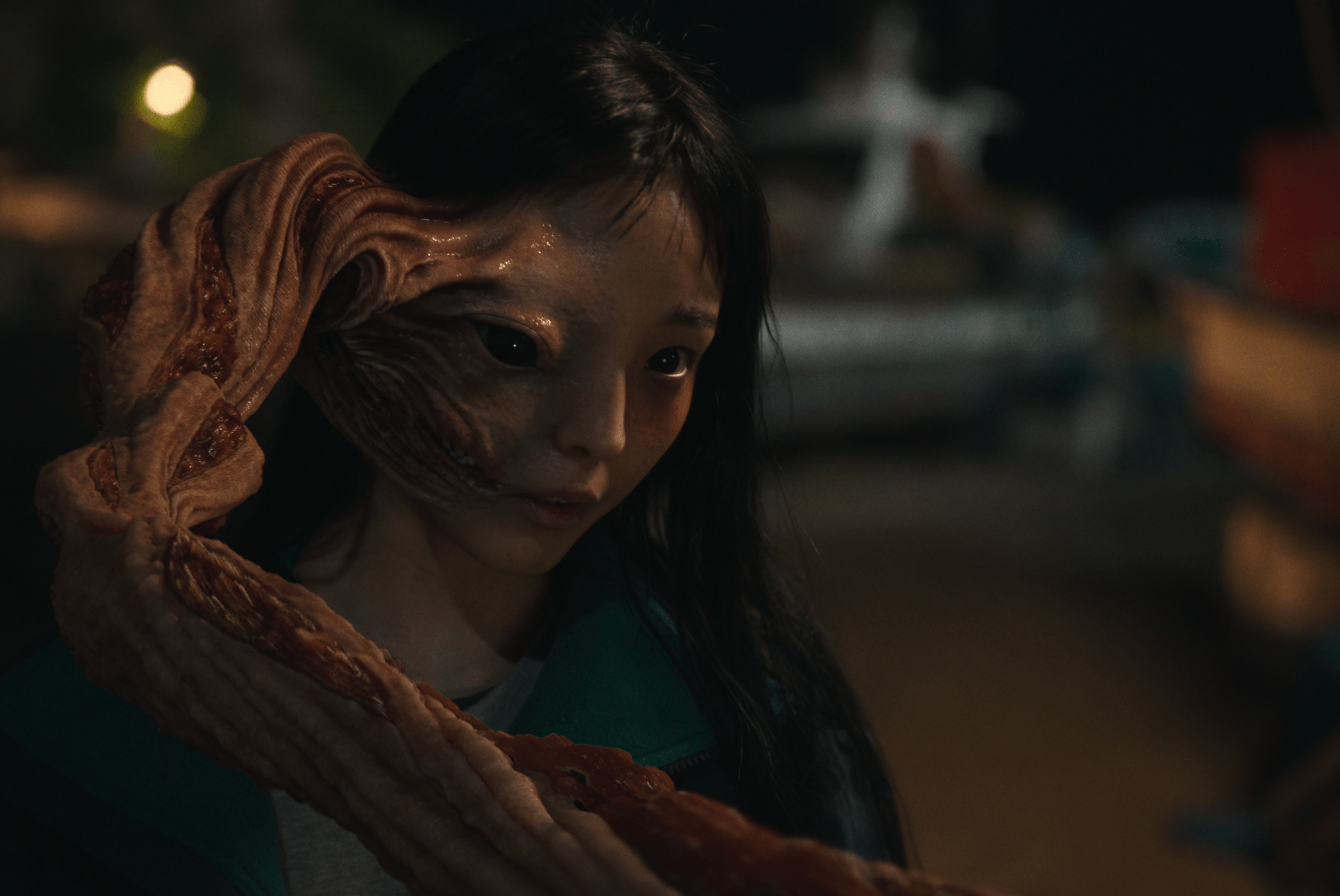 In Parasyte: The Gray, a creature with tentacles grows from the right side of Jeon So-nee's face