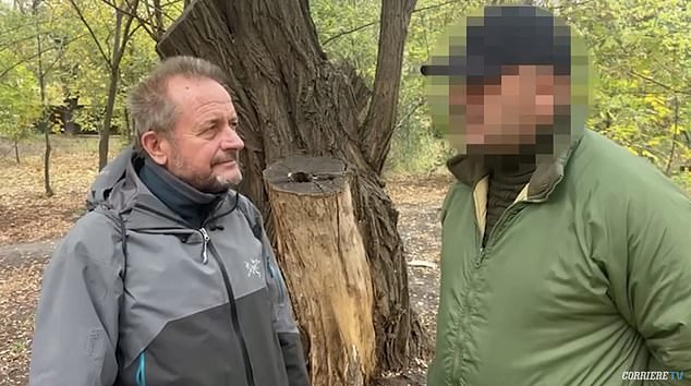 An elite sniper known as Ghost (right) has revealed he killed 147 Russian soldiers with shots fired from up to 1.5 km away