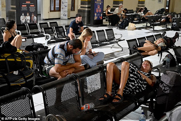 Staff from travel risk management company World Travel Protection helped stranded tourists (pictured) on the remote island of Flores, Indonesia, after multiple volcanic eruptions