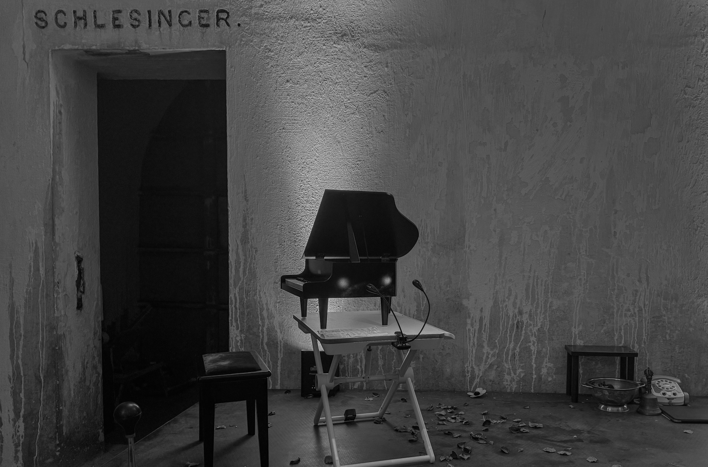 A toy piano set up in front of a doorway of Margaret Leng Tan's October 3, 2024 performance of Curios in the Catacombs at Green-Wood Cemetery in New York