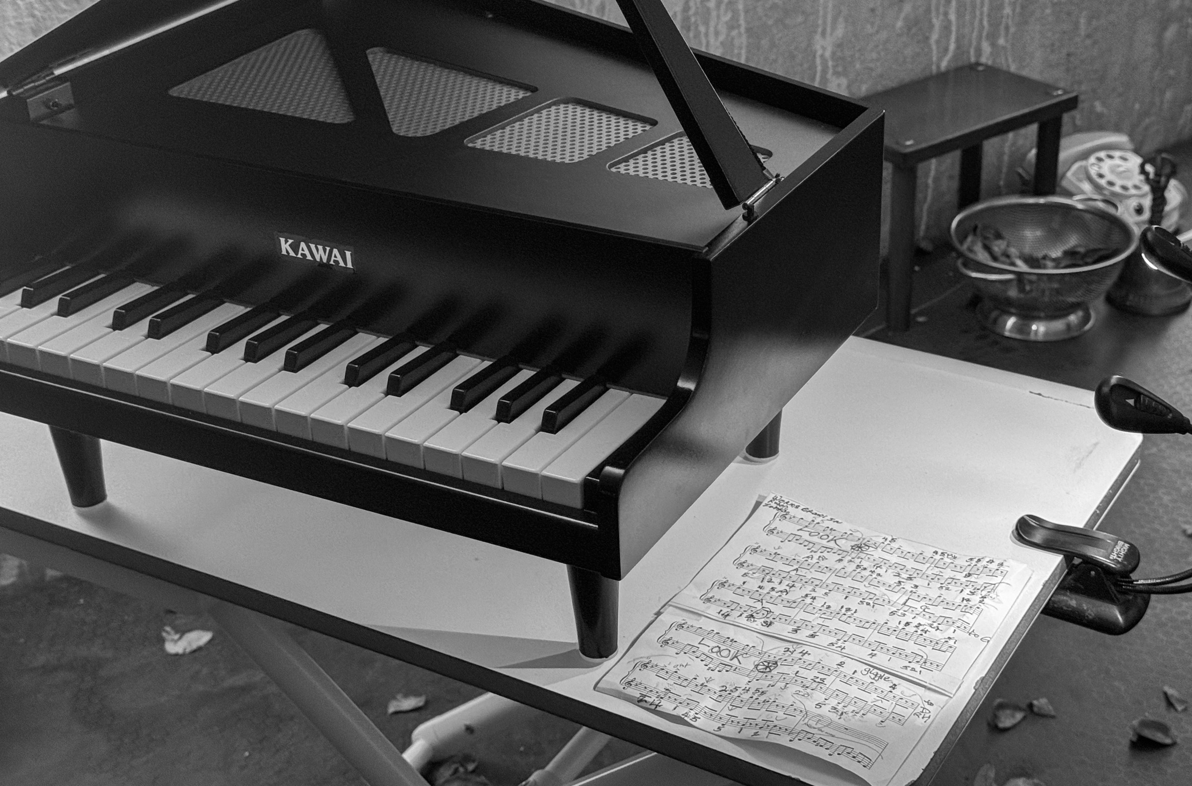 A toy piano and sheet music from Margaret Leng Tan's October 3, 2024 performance of Curios in the Catacombs at Green-Wood Cemetery in New York