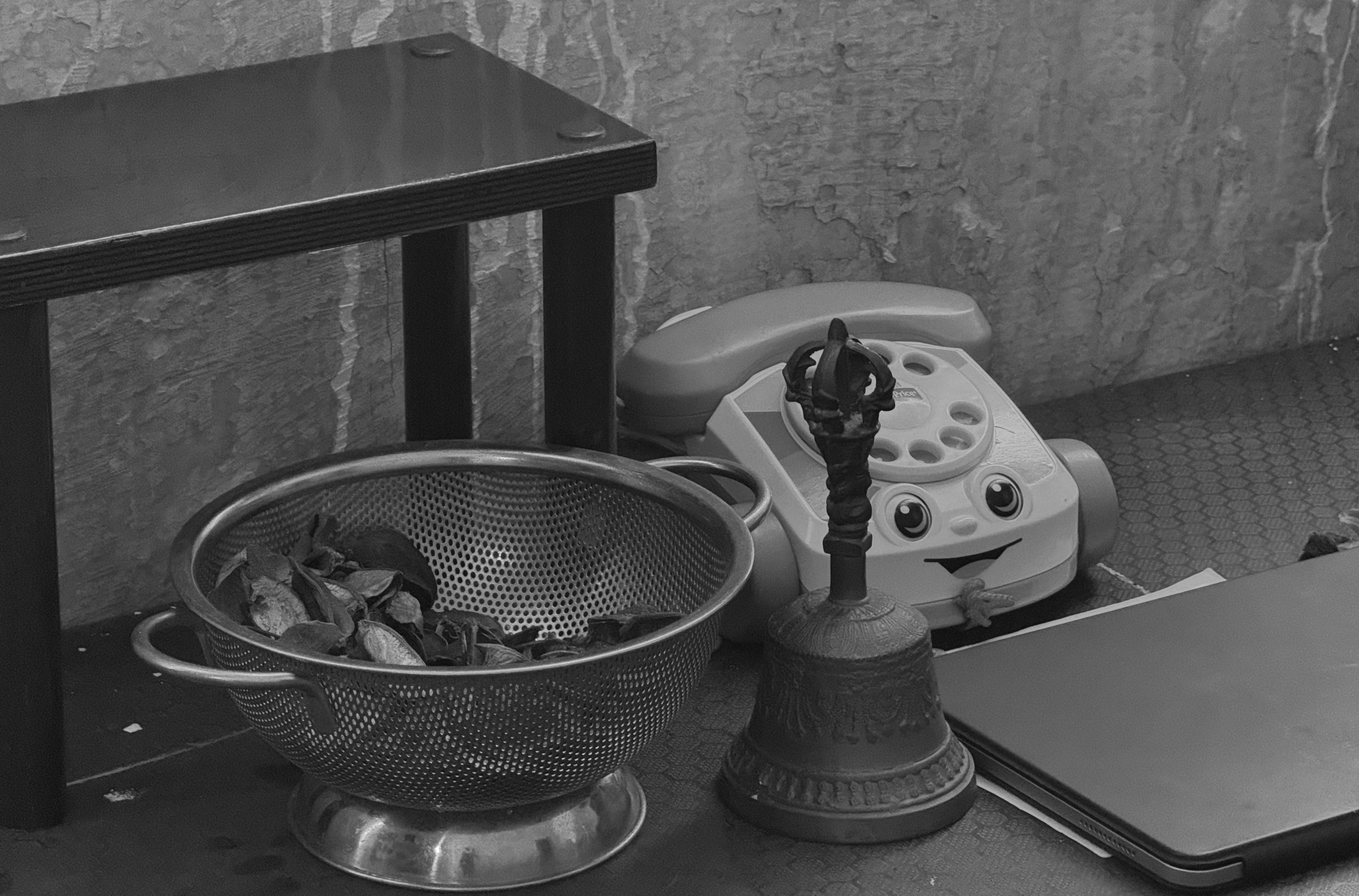 A toy telephone, a bell and an iPad from Margaret Leng Tan's October 3, 2024 performance of Curios in the Catacombs at Green-Wood Cemetery in New York