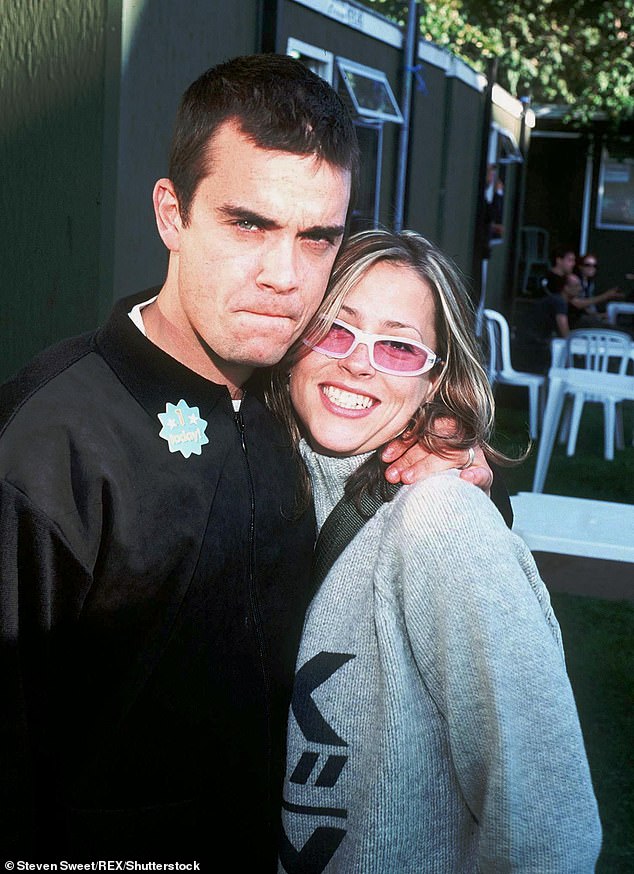 The All Saints star showed her support for the film, which covers her tumultuous Nineties romance with Robbie (Nicole and Robbie pictured in 1998)