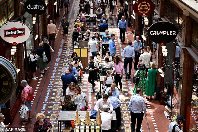 In 2023, the Christmas season left Australians $7.7 million in debt, according to sobering statistics from financial comparison site Finder (pictured, Sydney shoppers)