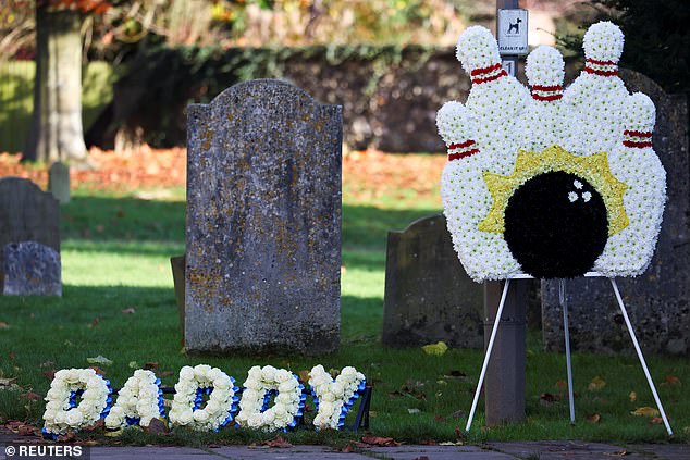 At the church in Buckinghamshire, white roses spelling out the word 'Daddy' were placed next to roses in the shape of a bowling ball knocking over some pins.