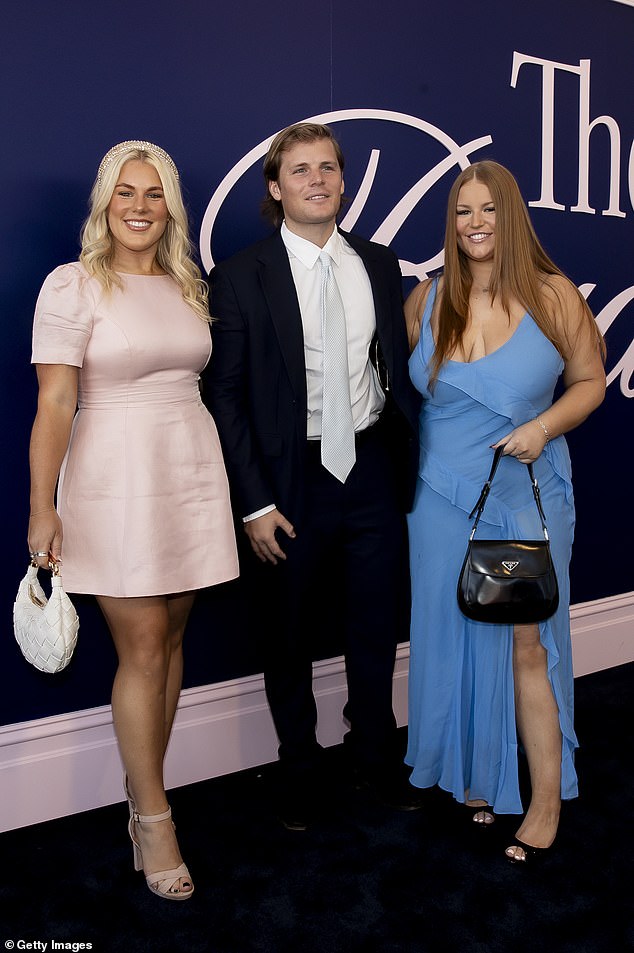 The blonde beauty appeared to be having the time of her life as she posed with her siblings Jackson, 25, and Summer, 23, at the event