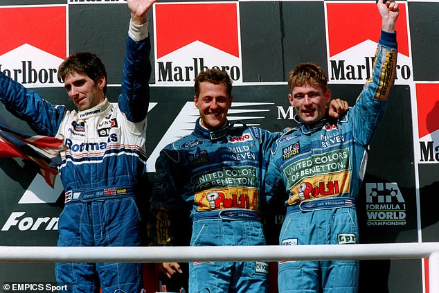 Michael Schumacher (center) defeated rival Hill (left) to win the Formula 1 world title in 1995