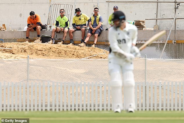 Construction workers banned from watching or filming India's top-secret training sessions at the WACA (Photo: Construction workers watch a Sheffield Shield match between Western Australia and Queensland at the WACA during a break)