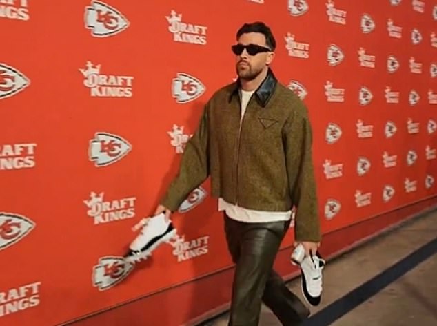 Travis Kelce arrived at Arrowhead Stadium on Monday wearing a brown jacket and leather pants