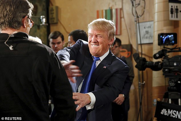 US Republican presidential candidate Donald Trump jokes with host Joe Scarborough after an appearance on MSNBC's Morning Joe cable television show at Java Joe's CoffeeHouse in Des Moines, Iowa.