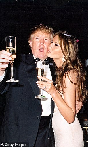 Trump and his then-future wife Melania raise their glasses for a New Year's toast at the Mar-a-Lago estate, Palm Beach, Florida, January 1, 2004