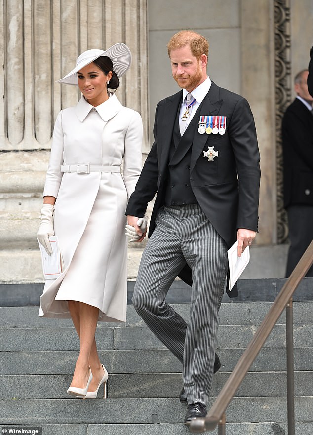 The Duke of Sussex's visa application was thrown into doubt after he admitted in his 2023 memoir that he used several drugs recreationally - which he should have disclosed in immigration documents. He is pictured with wife Meghan Markle in London in 2022