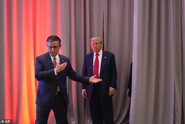 House Speaker Mike Johnson (left) accompanies President-elect Donald Trump (right) to a meeting with the House GOP conference on Wednesday