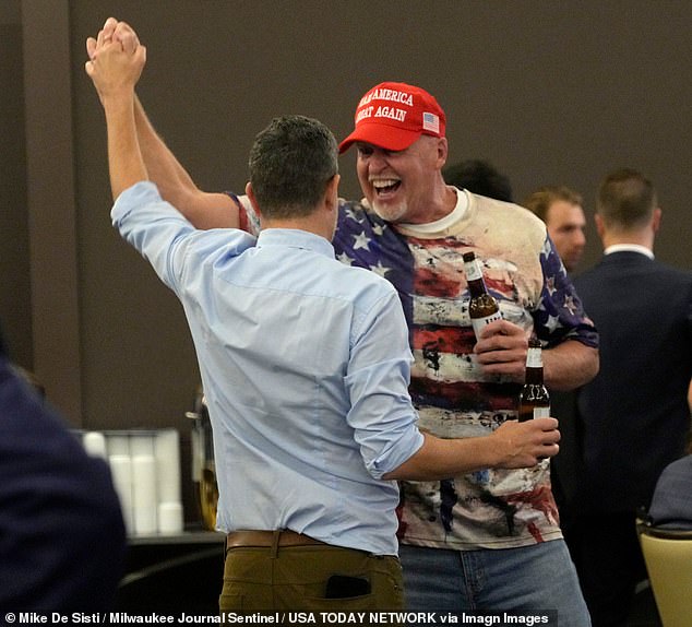 Voters celebrate in Madison, Wisconsin in the early hours of November 6 after hearing that the former Blue Wall state of Pennsylvania was being called for former President Trump