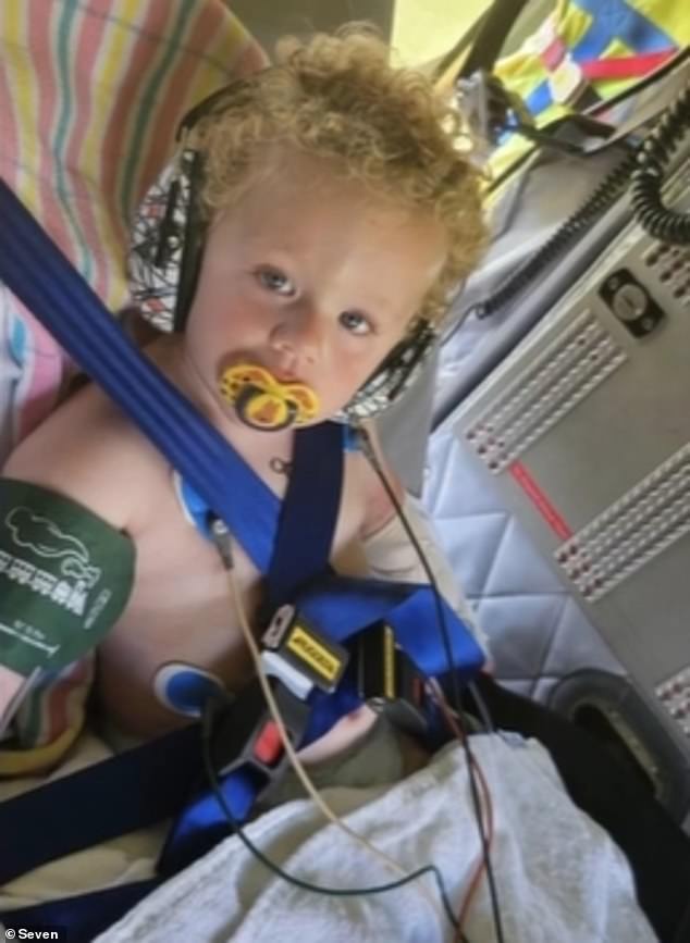 Ezra Porter has won praise from his family and doctors after quickly alerting his parents after being bitten by a snake (pictured as he was taken to hospital)