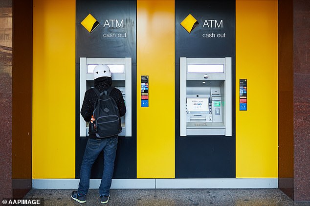 Australia's big banks are making a $200,000 profit on the average mortgage as they continue to close branches and remove ATMs, a new report has found (stock image)