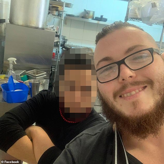 Jacob Greig, 32, a chef, poses for a photo in a commercial kitchen