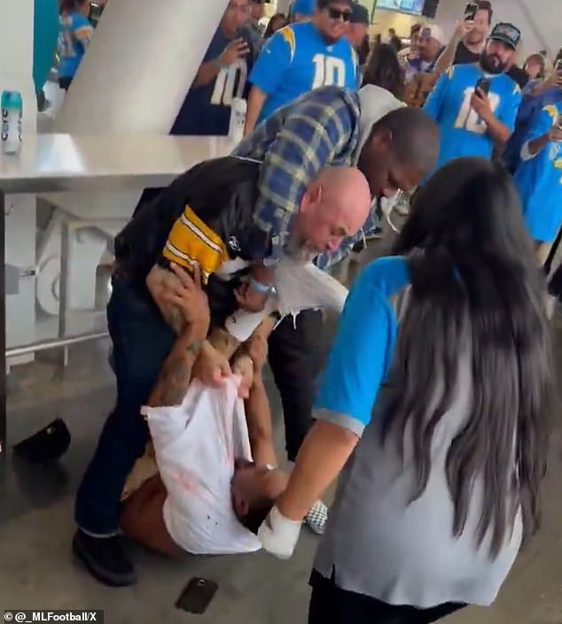 Two NFL fans got into a brutal fight that left one of them bleeding badly in Los Angeles