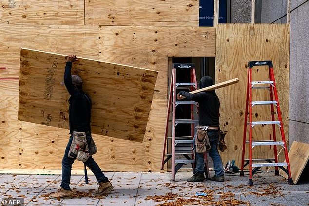 Storefronts and buildings are boarded up along Pennsylvania Avenue, near the White House