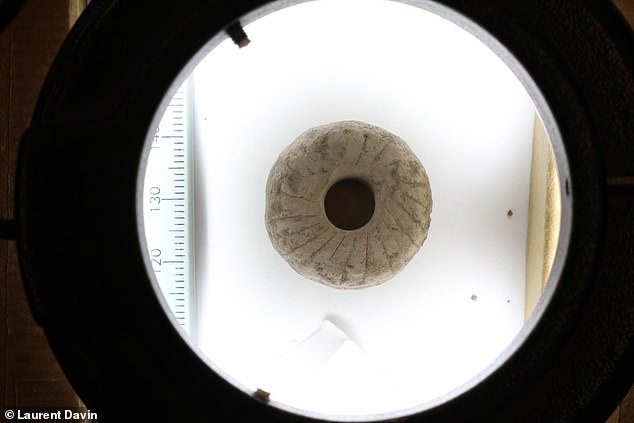 A collection of perforated pebbles from an archaeological site in Israel could mark another major milestone in the development of rotary tools – including wheels – experts say