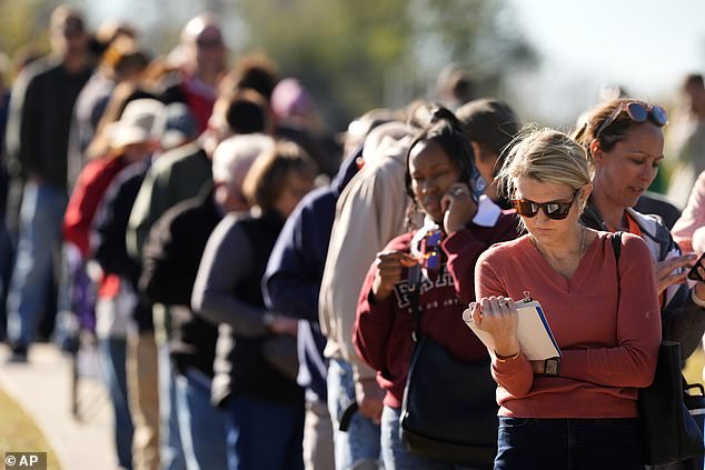 Voters wait in line at a polling location in Missouri on October 31