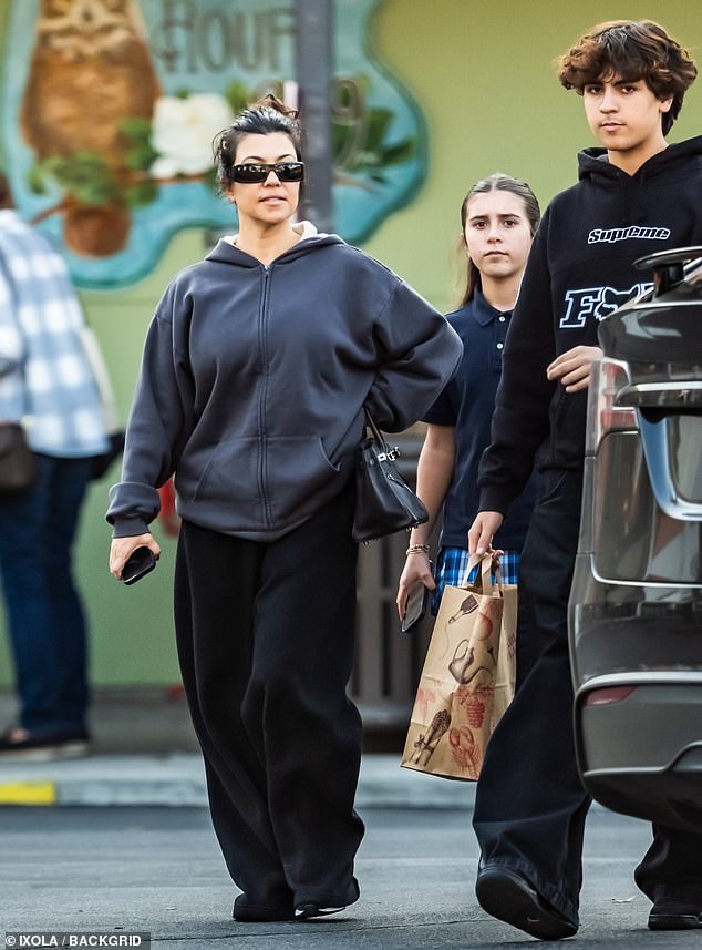 Kourtney - who is five feet tall - went to the store with Mason and her daughter Penelope, 12, on Monday