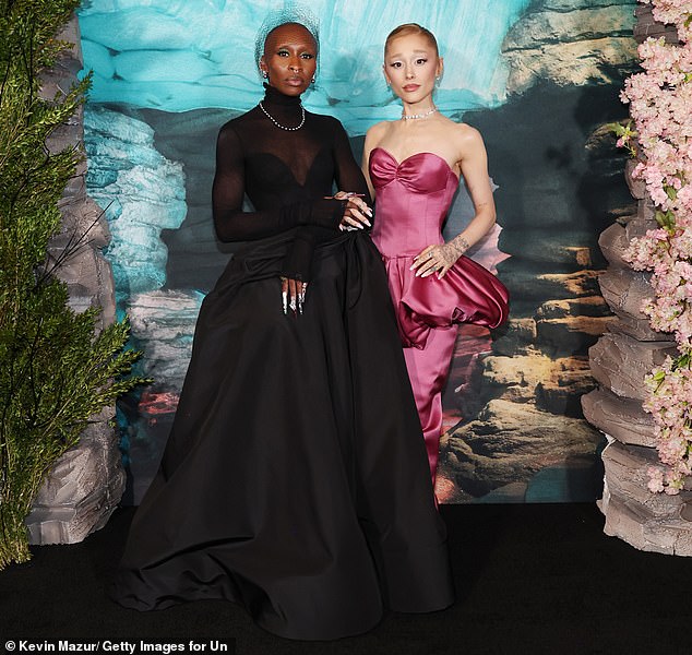 Bad fans are outraged after a major spoiler was revealed on social media ahead of the musical adaptation's release on Friday; Ariana Grande and Cynthia Erivo spotted in New York earlier this month