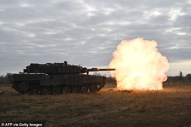 Ukrainian troops fire a Leopard 2A4 tank during a training exercise in Ukraine on October 27