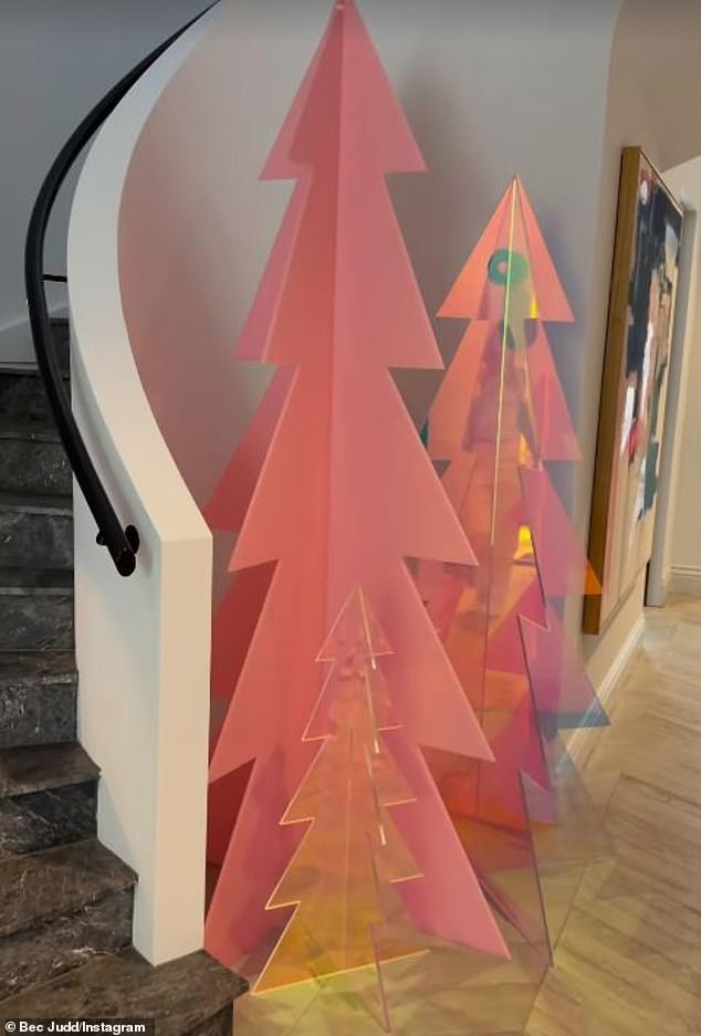 The large 2.1 meter pink cutout costs $1550, while the 1.5 meter clear acrylic tree costs $1250 and her 80cm tree costs $300.