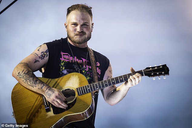 Country music star Zach Bryan, 28, has been acquitted in his ongoing case stemming from an arrest in Oklahoma last year. Pictured in Nashville in June