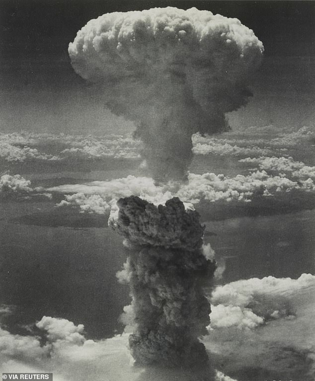 A mushroom cloud rises after a codenamed nuclear bomb "Fat man" exploded after being dropped by a U.S. Air Force B-29 bomber over Nagasaki, Japan, on August 9, 1945