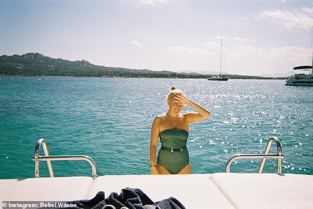 In one photo, Rebel and Ramona cuddled aboard a yacht before the designer took a dip