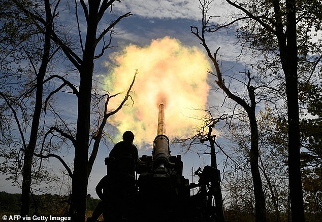 Ukrainian soldiers from the 43rd Artillery Brigade fire a 2S7 Pion self-propelled gun at Russian positions on a front line in the Donetsk region