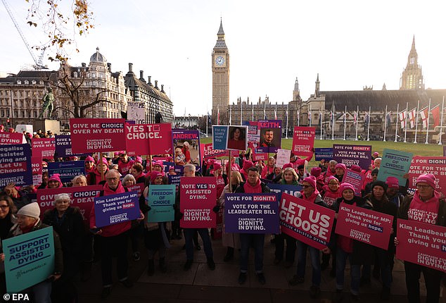 Activists supporting campaign group Dignity in Dying protest in Parliament Square ahead of today's vote