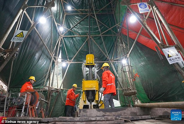 Drilling revealed rock samples containing as much as 138 grams of pure gold per tonne. Gold ore is considered high-grade if it contains only eight grams per tonne. Pictured: Geologists drilling for rock samples in the Wangu goldfield