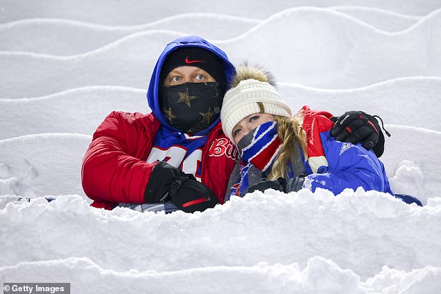 Fans climbed through piles of snow to reach their seats on a frigid night in Orchard Park