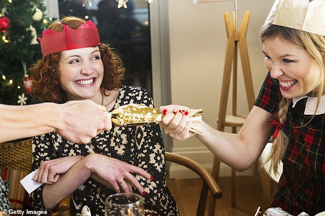 In Australia and Britain, it is a tradition for guests to crack open Christmas crackers, or chocolates, as they are often called. The cardboard tubes are wrapped in festive paper designs and contain a paper crown, a written joke or riddle and sometimes a toy