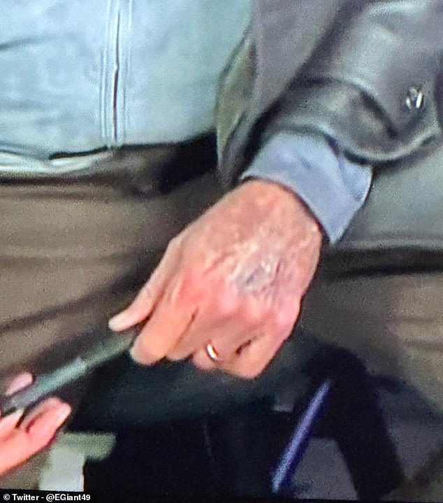 A close-up photo of Collinsworth's hand as seen on the Sunday Night Football broadcast