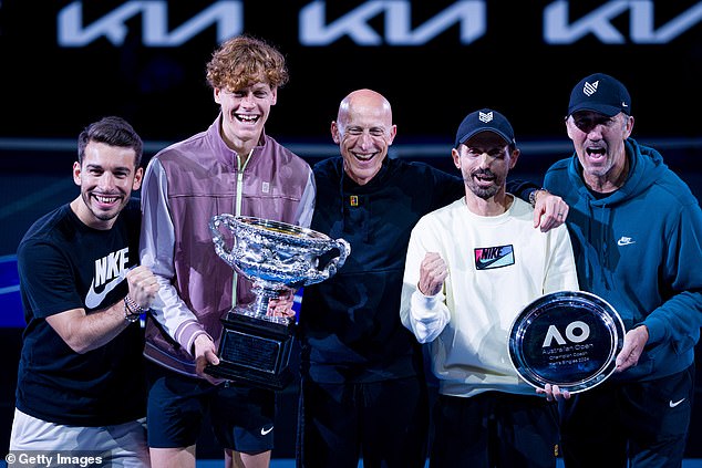 Physio Giacomo Naldi (left) and fitness coach Umberto Ferrara (right) pictured with Sinner (center) after the tennis star won the 2024 Australian Open in January