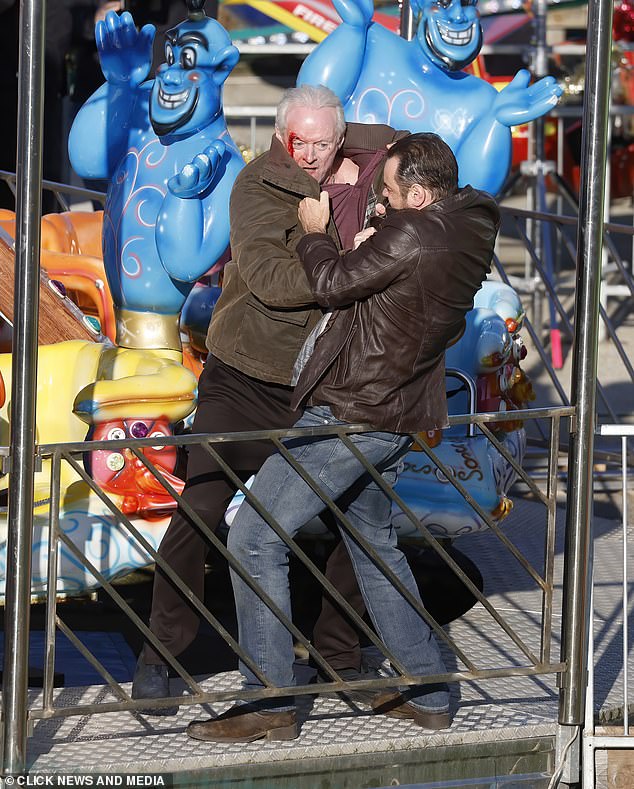 The star was seen with a huge gash on his head as he dripped blood in fight scenes at what appeared to be a fairground