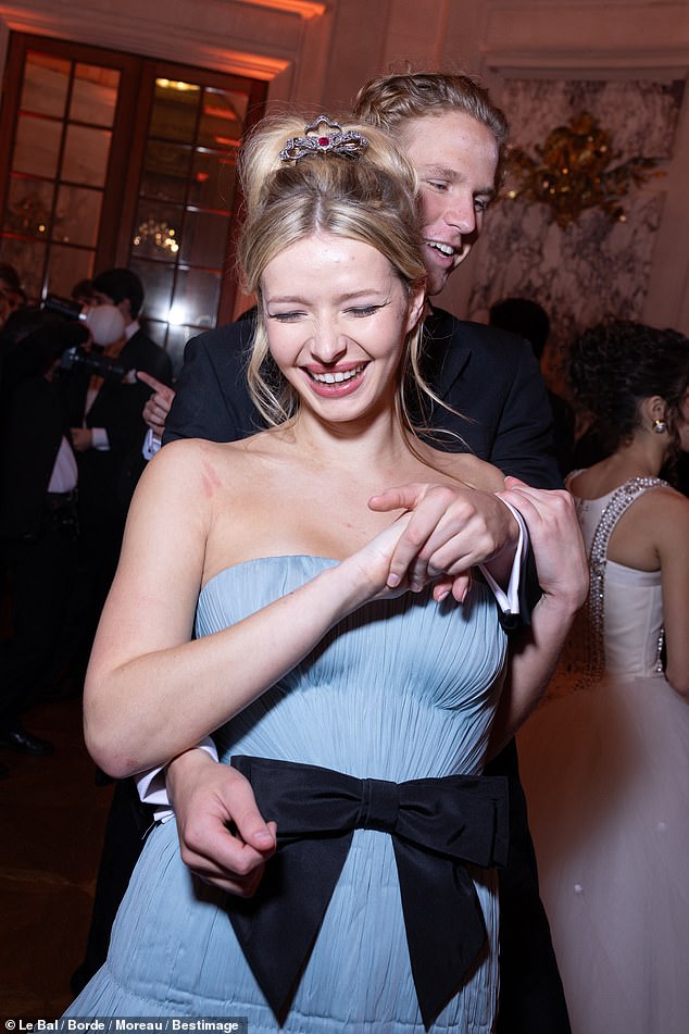 The 20-year-old daughter of Gwyneth Paltrow and Coldplay's Chris Martin, stunned in a strapless sky blue dress from Valentino's Spring 2025 collection as she danced gracefully with her eligible date