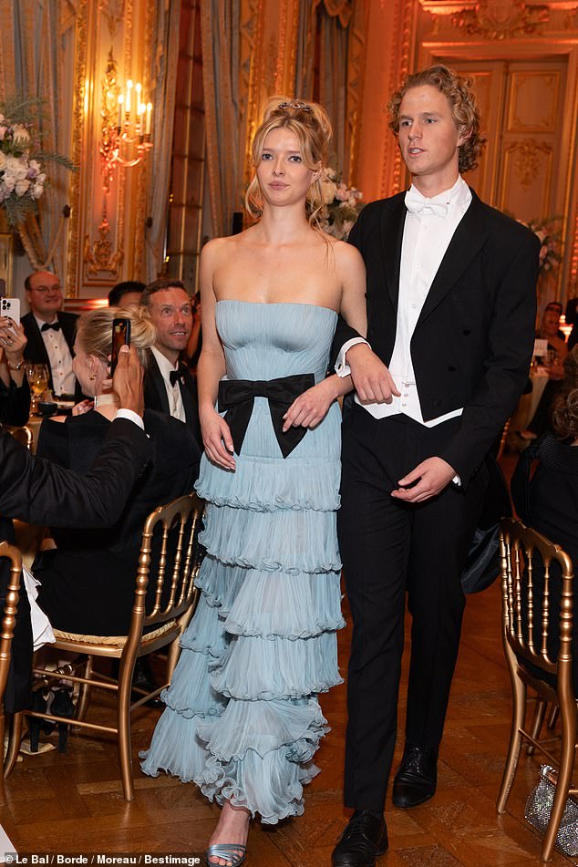 And while the debutantes take center stage, each of them is paired with a 'cavalier', often young men from a similar background, to make their grand entrance at the ball.